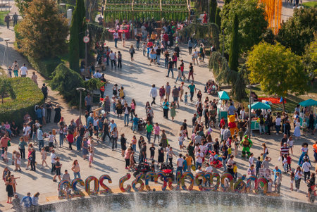 Georgia, Tbilisi - October 2, 2022: Group of anonymous People in City Parkのeditorial素材