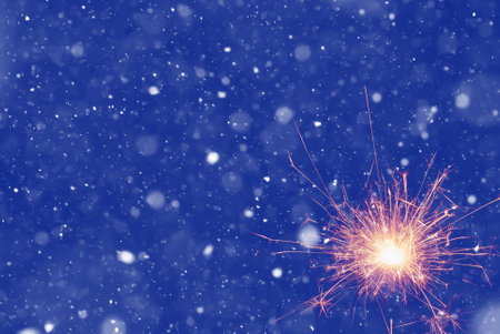 Burning sparkler on abstract snowy background. New Year celebration. 3d illustration.の写真素材