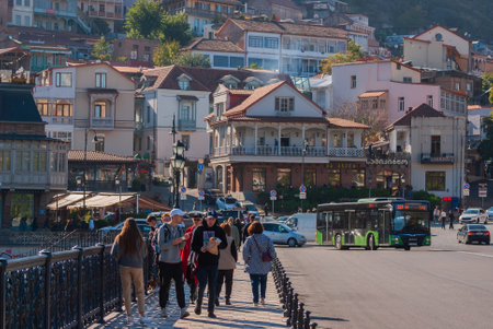 Georgia, Tbilisi - October 30, 2022: Crowd of anonymous people walking on busy city street.のeditorial素材