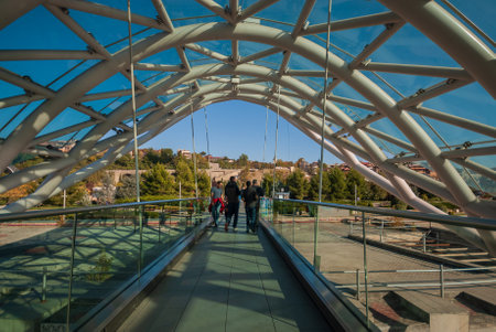 Georgia, Tbilisi - October 30, 2022: Bridge of Peace over the Kura River in Tbilisi, Georgia.のeditorial素材