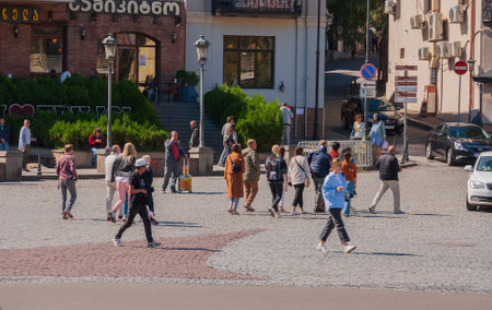 Georgia, Tbilisi - September 25, 2022: Crowd of anonymous people walking on busy city street.のeditorial素材