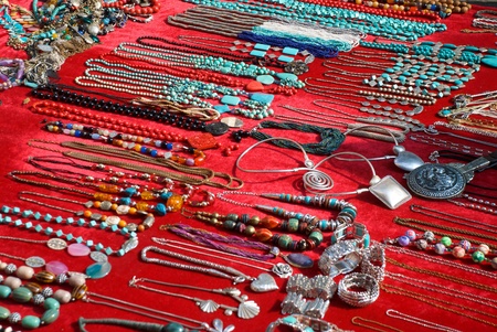 Colorful jewelry displayed on a red carpet in Shanghaiの写真素材