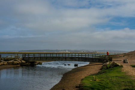 wooden bridge over a waterの写真素材