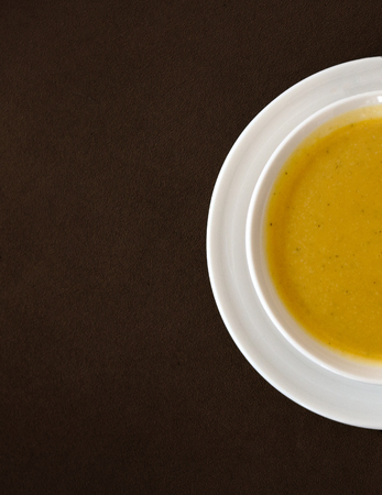 Top view of soup served in a white bowl and plateの写真素材