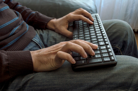 Man's hands on keyboard
