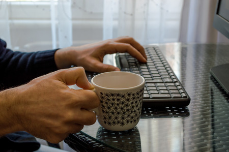 Man's hands on keyboardの写真素材