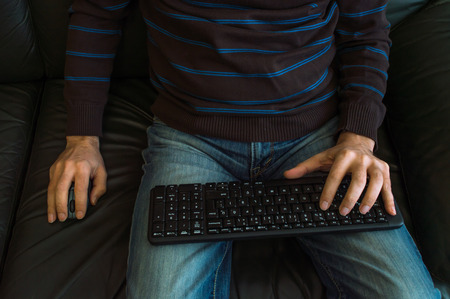 Man's hands on keyboardの写真素材