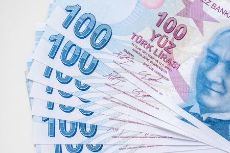 Bunch of 100 Turkish Lira (TRY) banknotes isolated on white background. Money growth and deposit accumulation concept.の写真素材