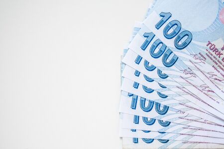 Bunch of 100 Turkish Lira (TRY) banknotes isolated on white background. Money growth and deposit...