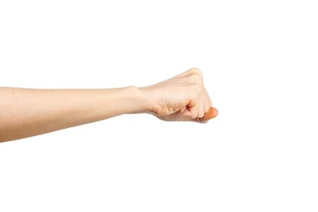 Caucasian female clenched fist on white background. Hand gesture. Gesticulation concept.の写真素材