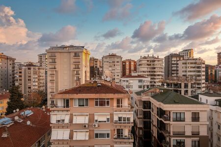 Aerial view of city apartment buildings with beautiful sunset view in Suadiye, Istanbul, Turkeyの写真素材