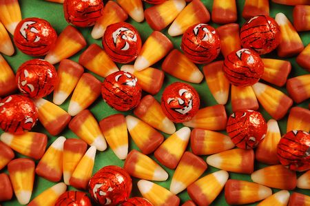 Halloween candy corn with pumpkinsの写真素材