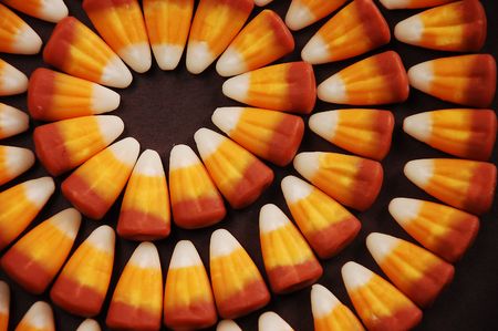 Candy corn on black background