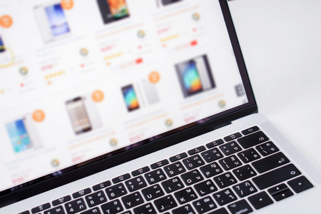 Blurry images of online shopping screens on a computer.の写真素材