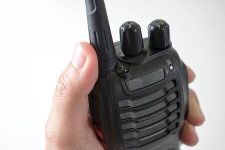 Close to the hand, using radio communication. isolated on white background.の写真素材