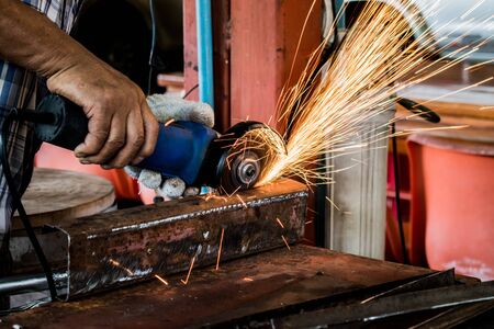 Electric grinding wheel on steel structure.の写真素材