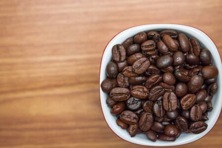 Close up texture of coffee beans in a glass.