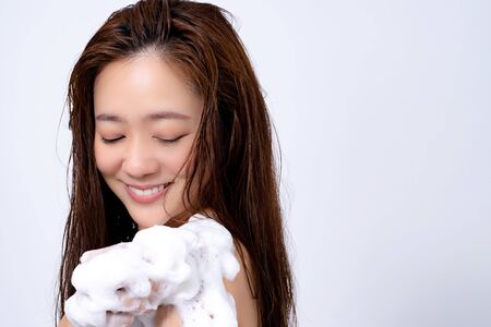 Asian women smile and enjoy with the shower.の写真素材
