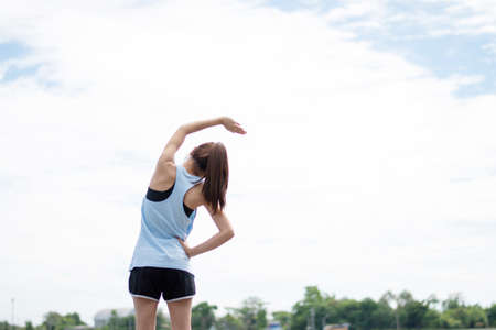 Woman stretch before exercise in the morning.の写真素材