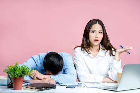Beautiful woman was dissatisfied with the actions of her colleague. He was so tired he slept on his...