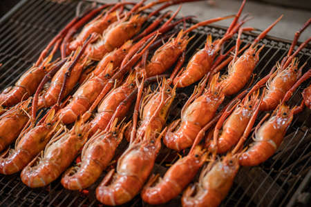 Grilled shrimps on the flaming grill.の写真素材