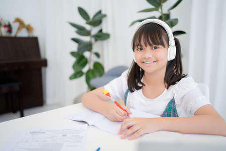 Little children, girls smiling and studying hard.の写真素材