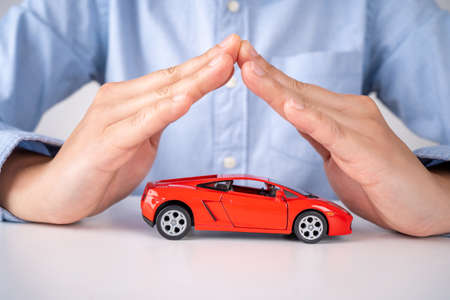Male hands and car as protection of car concept.の写真素材