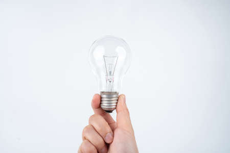 Light bulk in woman hand, concept idea.