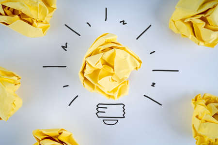 Inspiration concept crumpled paper light bulb metaphor for good idea. Creative idea.の写真素材