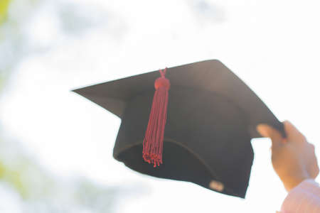 Graduation, Blurred image of student hold hats in hand during commencement success graduates of the universityの写真素材