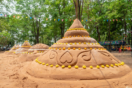 Thai people come to build the Sand Pagoda for return the sand to the temple on Songran festivalの写真素材