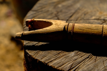 A slingshot on a logの写真素材