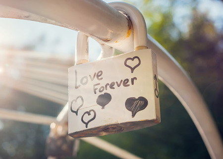 Love forever padlock with lens flareの写真素材