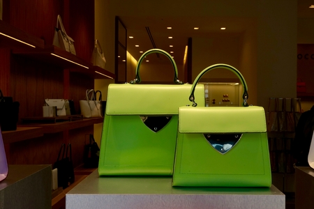 close up of two green hand bags