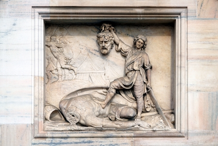 marble picture of a decapitated soldier at the Milan Cathedralの写真素材