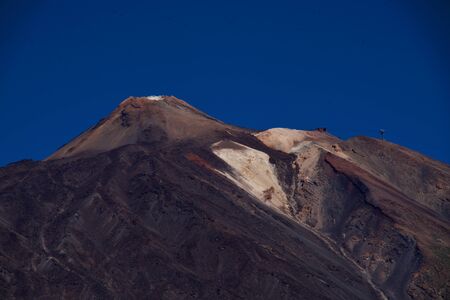 Top of a volcano under a blue skyの写真素材