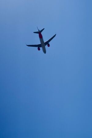 Airplane flying away from hereの写真素材