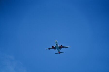 airplane in the blue skyの写真素材