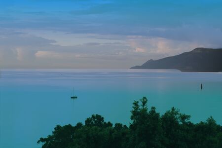 Lonely boat on the turquoise seaの写真素材