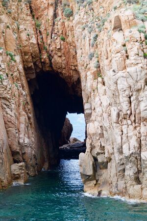 close-up of a passage in a rock in the oceanの写真素材