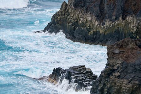 Rocks in the ocean spindriftの写真素材