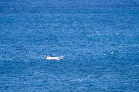 Fishing boat on the blue oceanの写真素材