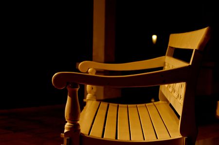 The white bench and orange light in resortの写真素材