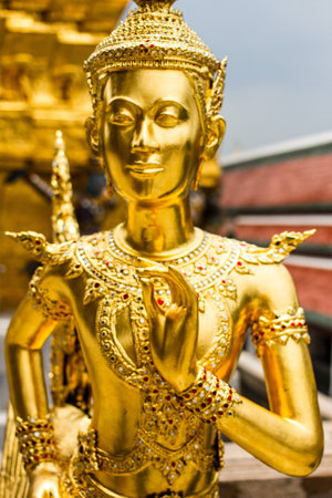 Golden angel statue of the Emerald Buddha temple(Wat phra kaew) and Royal Grand Palace ,Bangkok,Thailand.の写真素材