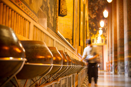 Monk's old alms bowls for donate Wat Phra Chetupon Vimolmangklararm (Wat Pho) temple in Thailand.のeditorial素材