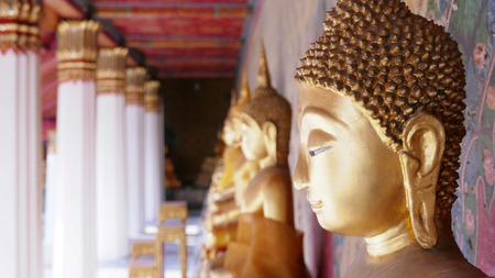 Buddha gold statue and thai art architecture in Wat Arun buddhist temple in Bangkok, Thailandのeditorial素材