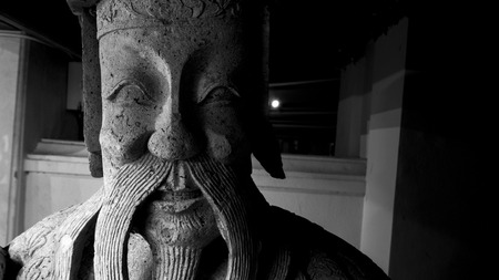 Black and white style image of   beautiful of  stone chinese style   sculpture and thai art architecture in  in Wat Phra Chetupon Vimolmangklararm (Wat Pho) temple in Thailand.の写真素材