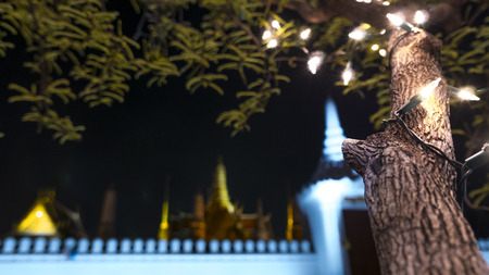 Bokeh image style of  night  lighting on the tree of Royal Grand Palace ,Bangkok,Thailand.の写真素材