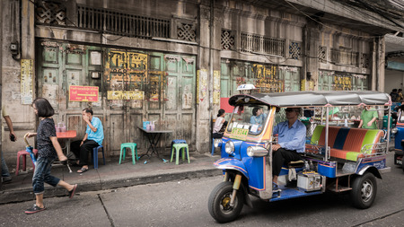 Bangkok, Thailand - September 9, 2016 : Unidentified people and tuktuk taxi with background classic...