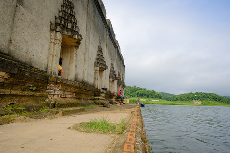 Kanchanaburi, Thailand - October 14, 2016: A public ancient old vihara hall left in the forest for hundred years in wiwekaram temple ,Sangkhaburi,Kanchaburi,Thailand.の写真素材